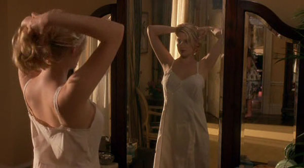 Katey Miller in front of a mirror